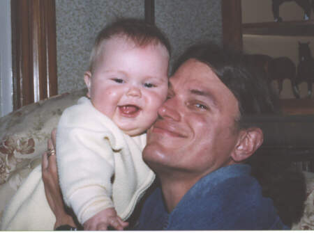 Isabelle and Dad cuddle